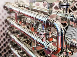 Overhead view of an industrial piping system in a commercial facility.